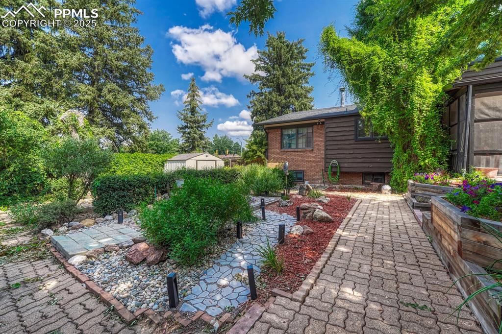4307 Valli Vista Road Colorado Springs, CO 80915 - Photo 36 of 47 a view of a pathway with a lounge chair