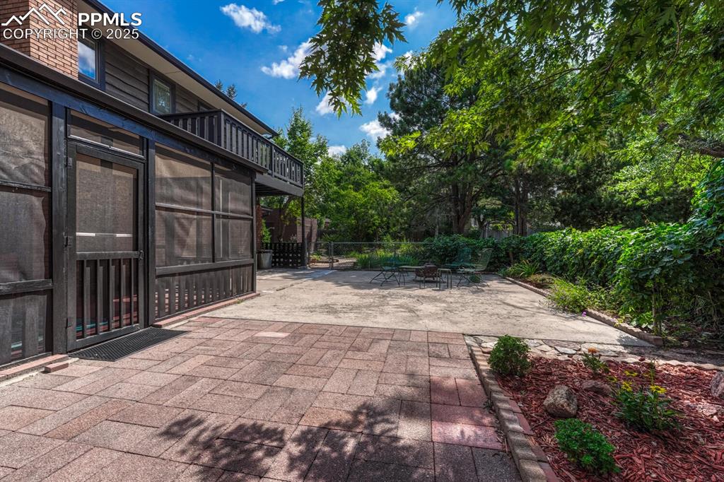 4307 Valli Vista Road Colorado Springs, CO 80915 - Photo 39 of 47 a backyard of a house with lots of green space