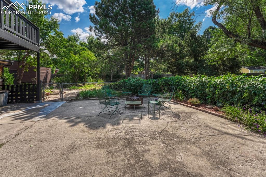 4307 Valli Vista Road Colorado Springs, CO 80915 - Photo 42 of 47 a view of backyard with swimming pool and green space
