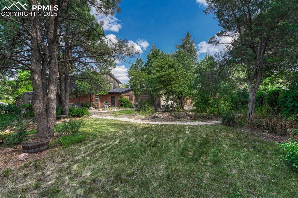 4307 Valli Vista Road Colorado Springs, CO 80915 - Photo 45 of 47 a view of a house with a yard