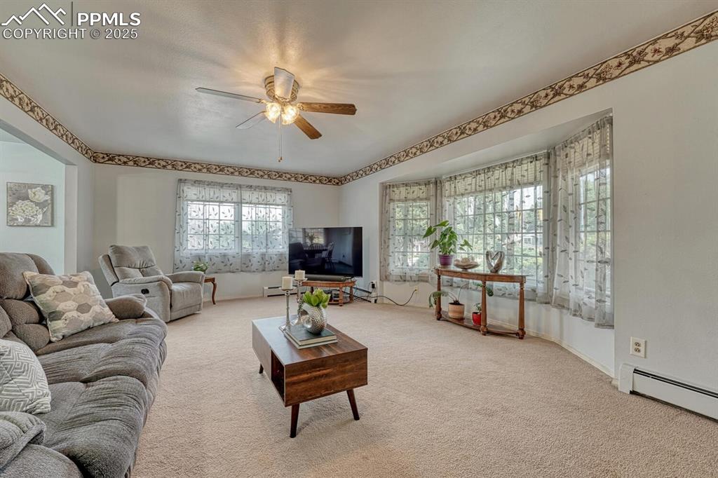 4307 Valli Vista Road Colorado Springs, CO 80915 - Photo 8 of 47 a living room with furniture and a large window
