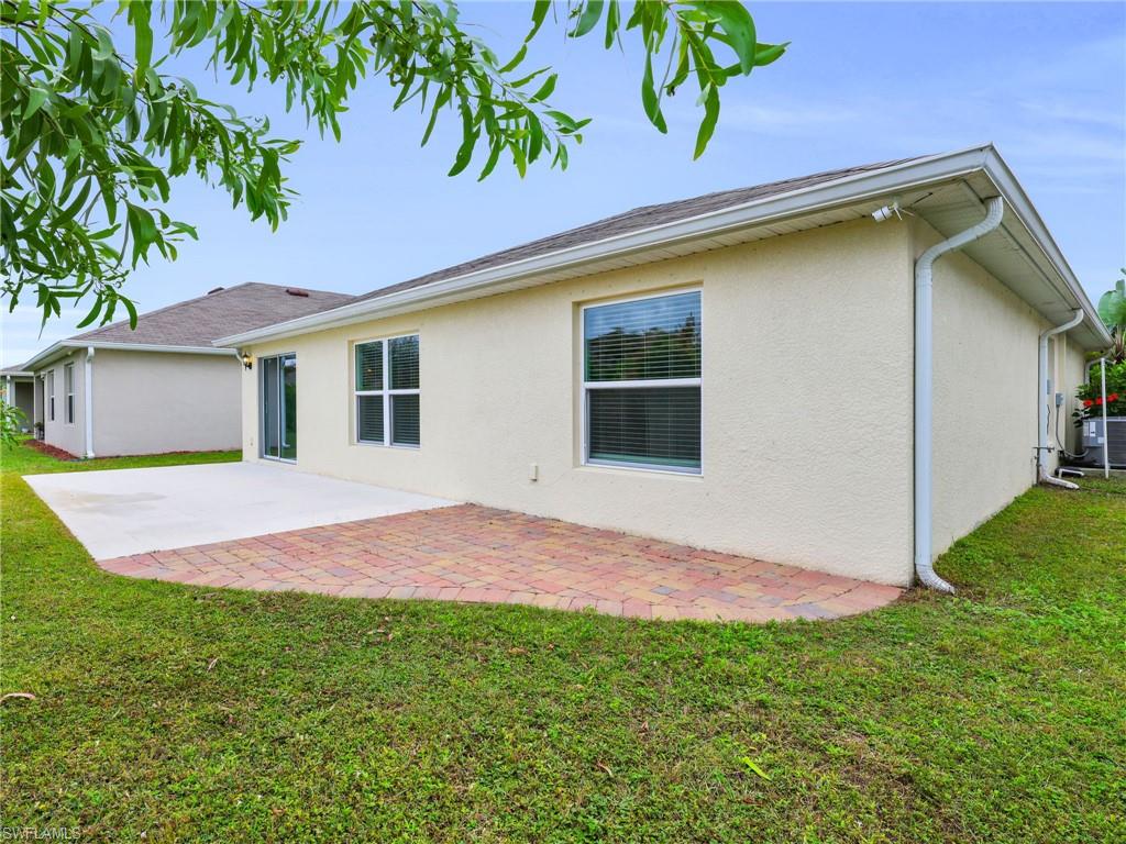 731 Hadley Place West Naples, FL 34104 - Photo 29 of 30 Rear View of Paver Patio And Concrete Pad