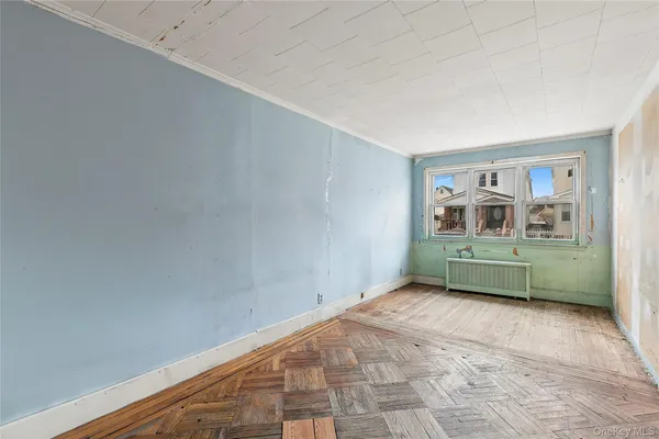 a room with a window and a chair