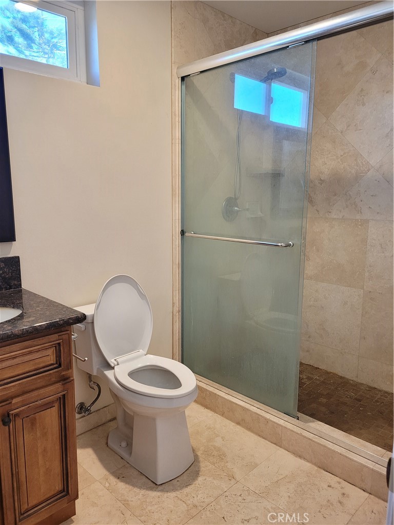 11896 Firebrand Circle Garden Grove, CA 92840 - Photo 17 of 37 a bathroom with a toilet and a shower