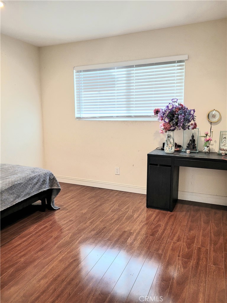 11896 Firebrand Circle Garden Grove, CA 92840 - Photo 19 of 37 a view of a room with wooden floor and a potted plant