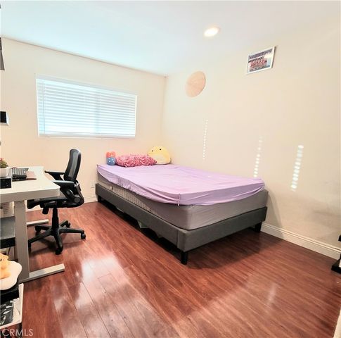 a bedroom with a bed and a table