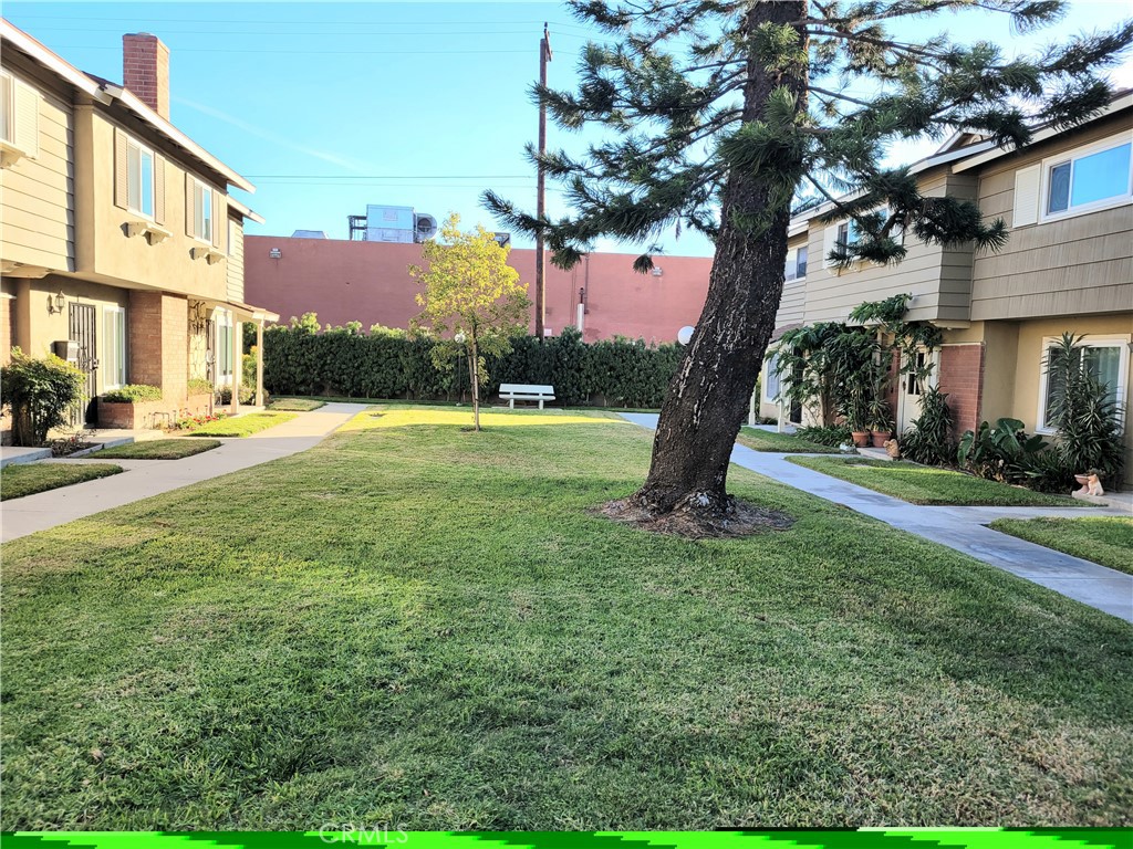 11896 Firebrand Circle Garden Grove, CA 92840 - Photo 30 of 37 a view of a backyard with a garden and entertaining space