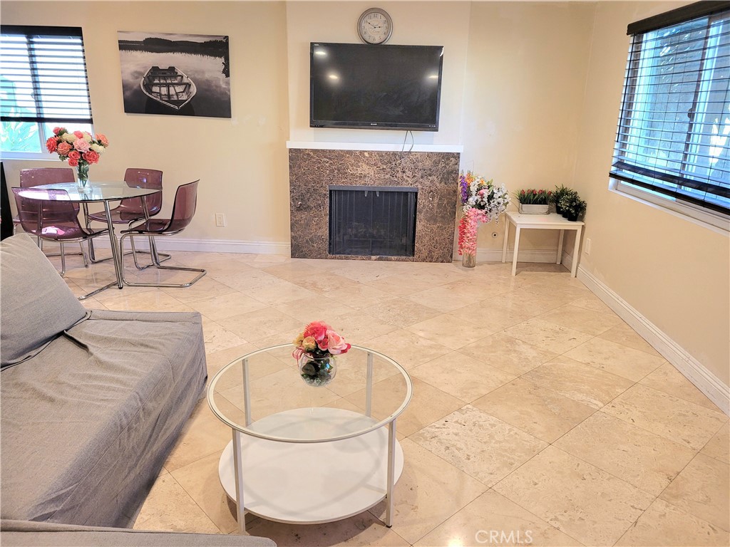 11896 Firebrand Circle Garden Grove, CA 92840 - Photo 3 of 37 a living room with furniture and a fireplace
