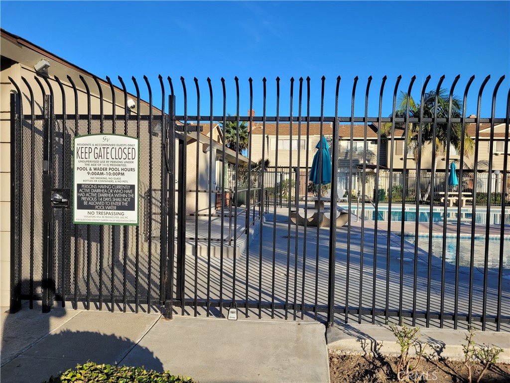 11896 Firebrand Circle Garden Grove, CA 92840 - Photo 34 of 37 a view of a porch with wooden fence