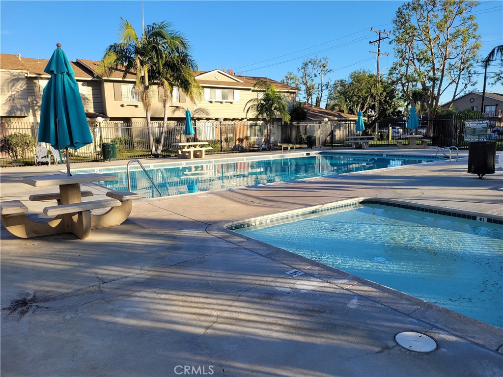 11896 Firebrand Circle Garden Grove, CA 92840 - Photo 37 of 37 a view of swimming pool with outdoor seating and house in the background