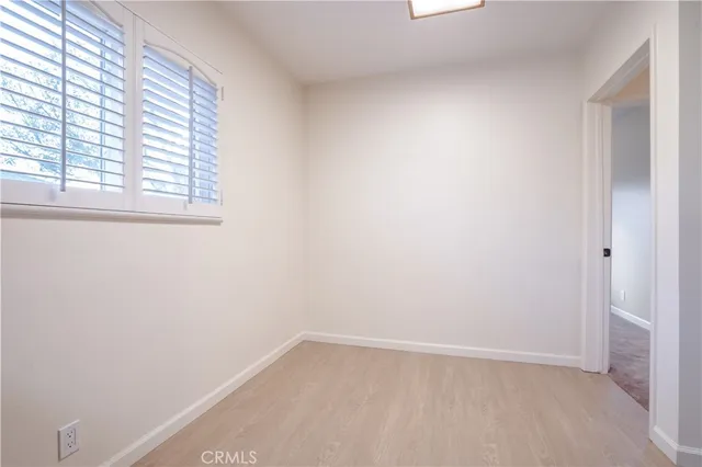 a bathroom with a granite countertop sink a toilet and a mirror