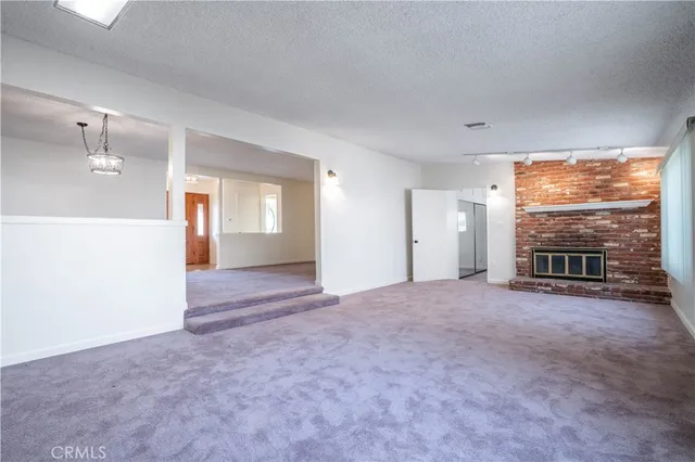 a view of livingroom with furniture and floor to ceiling window