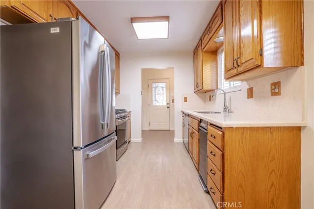 a view of a kitchen cabinets and a wooden floor