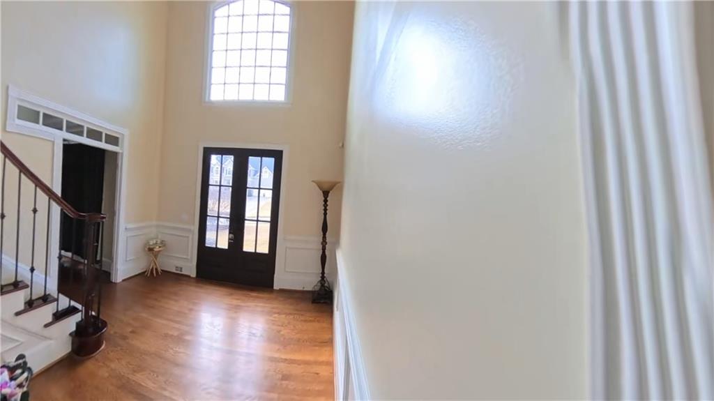 12313 Sunset Maple Terrace Alpharetta, GA 30005 - Photo 17 of 31 a view of livingroom with hardwood floor and window