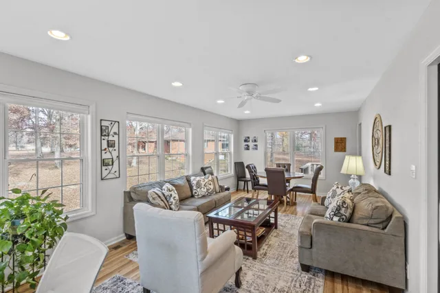a dining room with furniture window and outside view