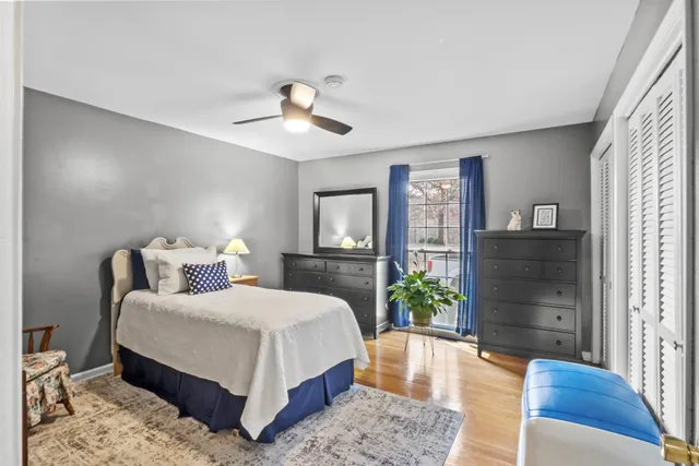 a bedroom with furniture and a window