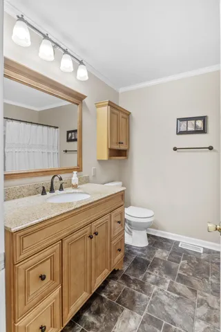 a spacious bedroom with a large bed and a large window