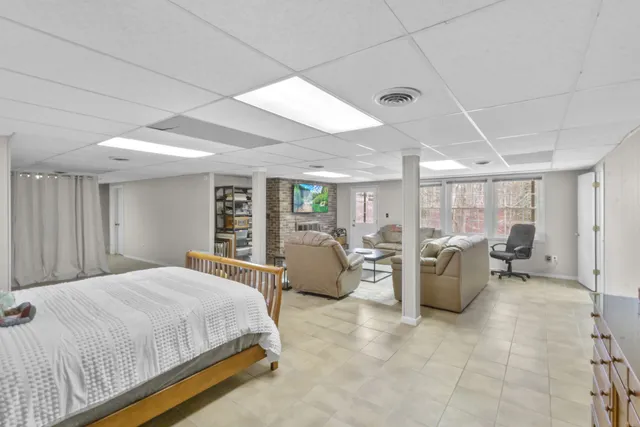 a room with furniture and a book shelf