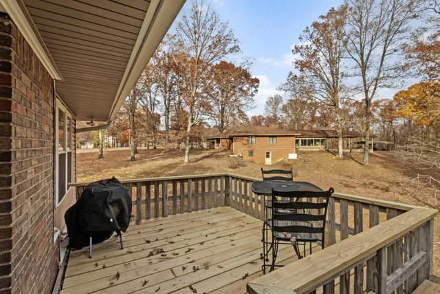 a backyard of a house with large trees