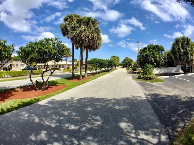 660 Glouchester Street, Unit 105 Boca Raton, FL 33487 - Photo 2 of 13 a view of a park with a slide