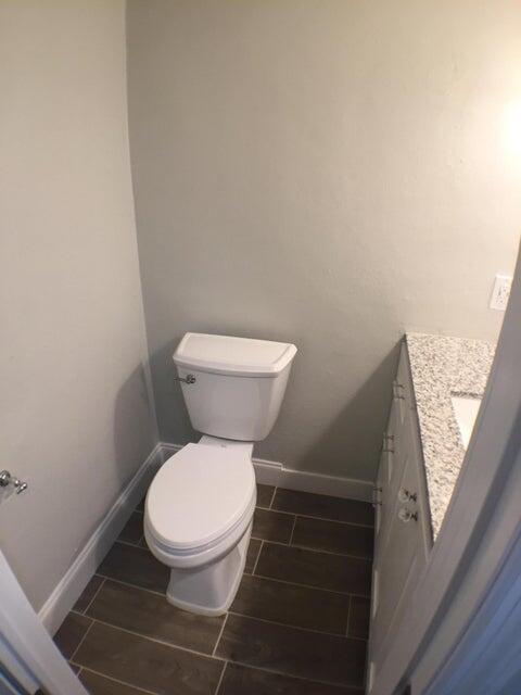 660 Glouchester Street, Unit 105 Boca Raton, FL 33487 - Photo 8 of 13 a white toilet sitting next to a window