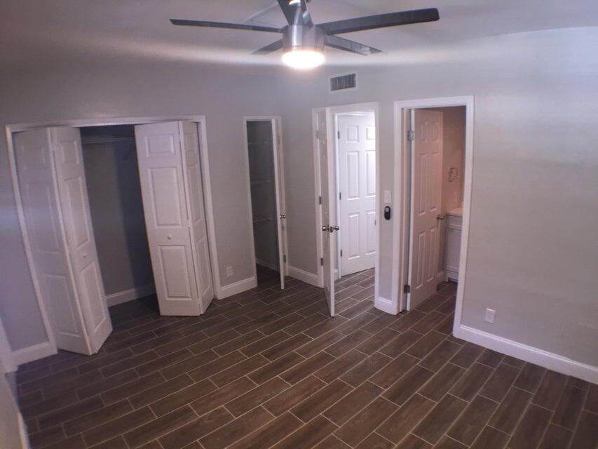 660 Glouchester Street, Unit 105 Boca Raton, FL 33487 - Photo 10 of 13 a view of empty room with wooden floor