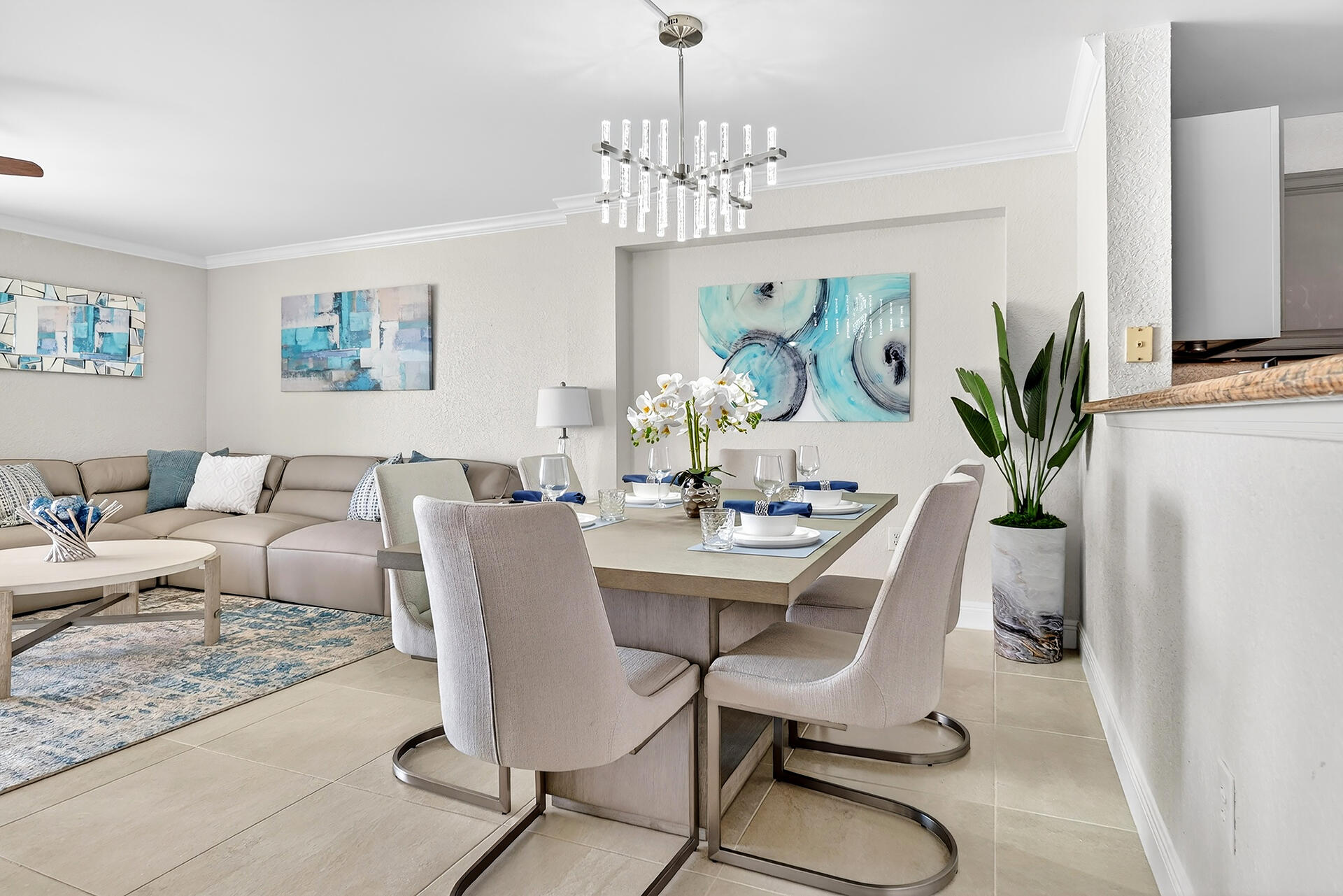 a view of a dining room with furniture a rug and wooden floor