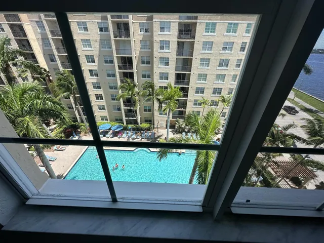 a view of living room with a window and tub