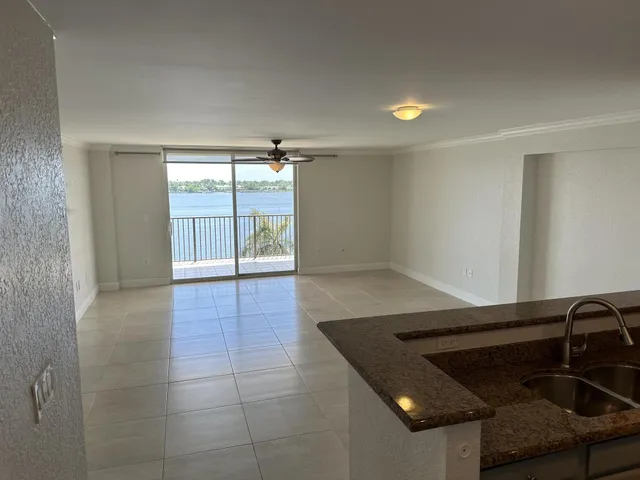 a view of a livingroom with an empty space and a window