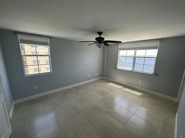 a view of an empty room and a window