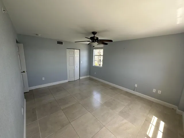 a view of an empty room with a window