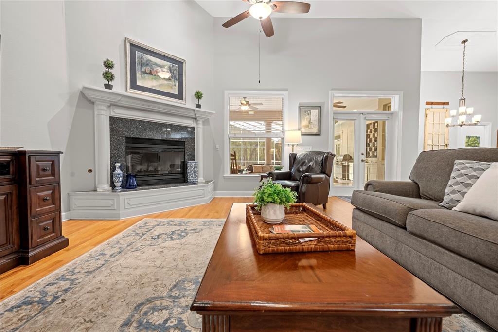 23245 Croom Road Brooksville, FL 34601 - Photo 11 of 79 a living room with furniture and a fireplace