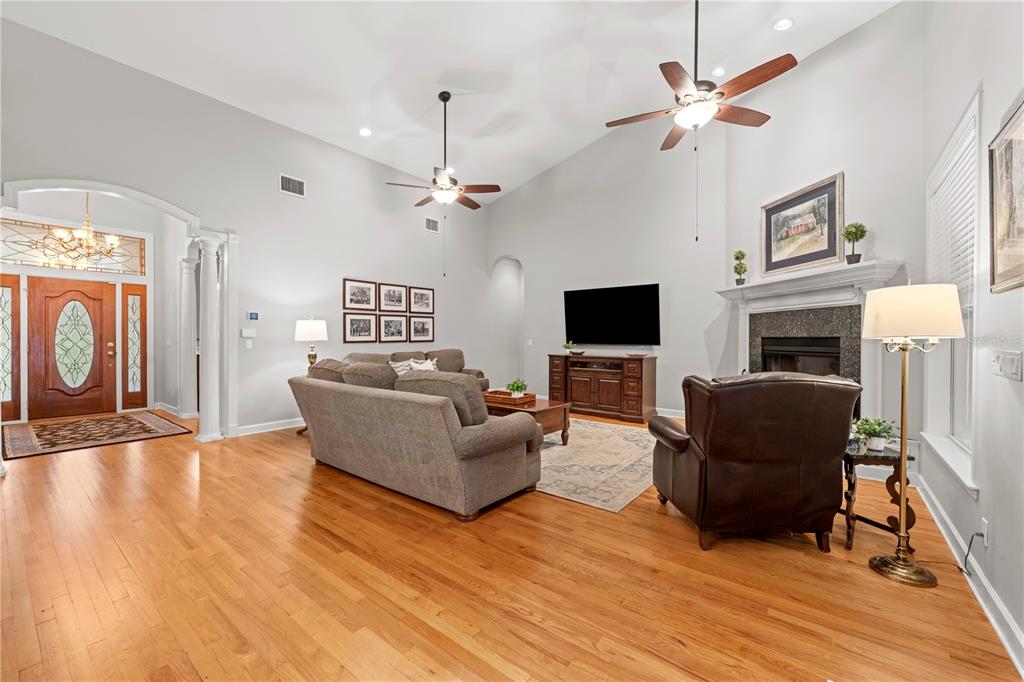 23245 Croom Road Brooksville, FL 34601 - Photo 12 of 79 a living room with furniture and a flat screen tv