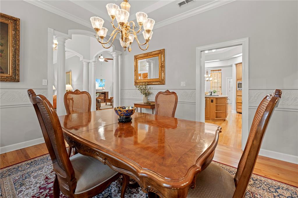 23245 Croom Road Brooksville, FL 34601 - Photo 24 of 79 a dining room with furniture and chandelier