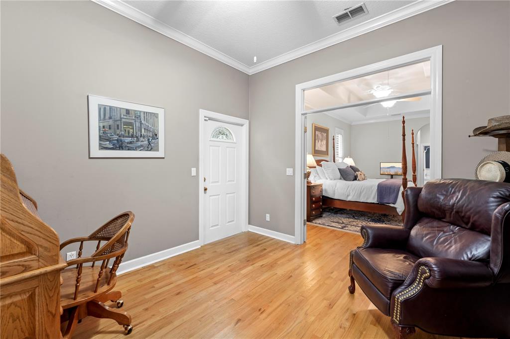 23245 Croom Road Brooksville, FL 34601 - Photo 31 of 79 a living room with furniture and a wooden floor
