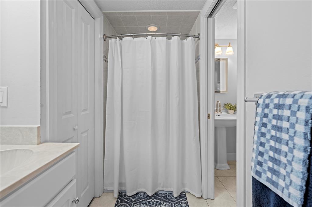 23245 Croom Road Brooksville, FL 34601 - Photo 40 of 79 a bathroom with a shower curtain and a sink