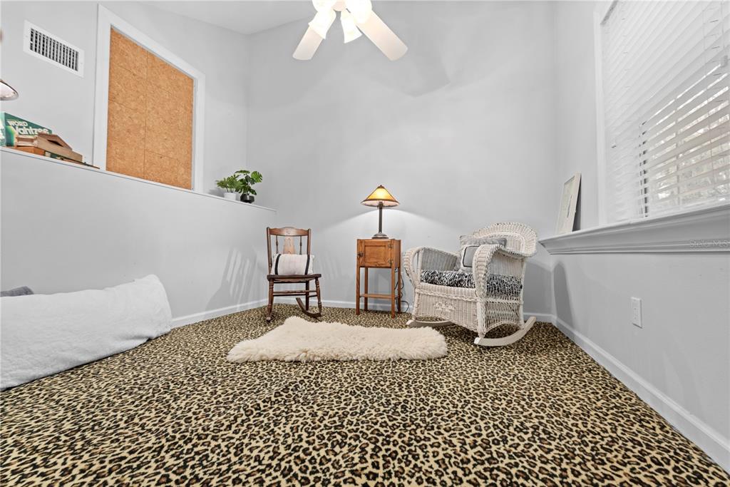 23245 Croom Road Brooksville, FL 34601 - Photo 45 of 79 a bedroom with a bed and a table