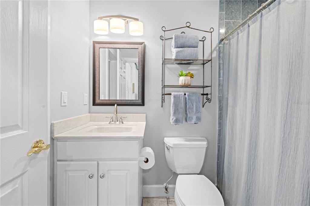 23245 Croom Road Brooksville, FL 34601 - Photo 52 of 79 a bathroom with a toilet sink and mirror