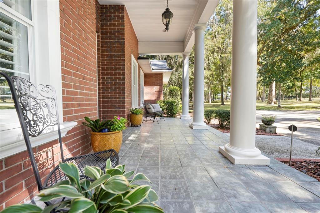 23245 Croom Road Brooksville, FL 34601 - Photo 7 of 79 a front view of a house with garden