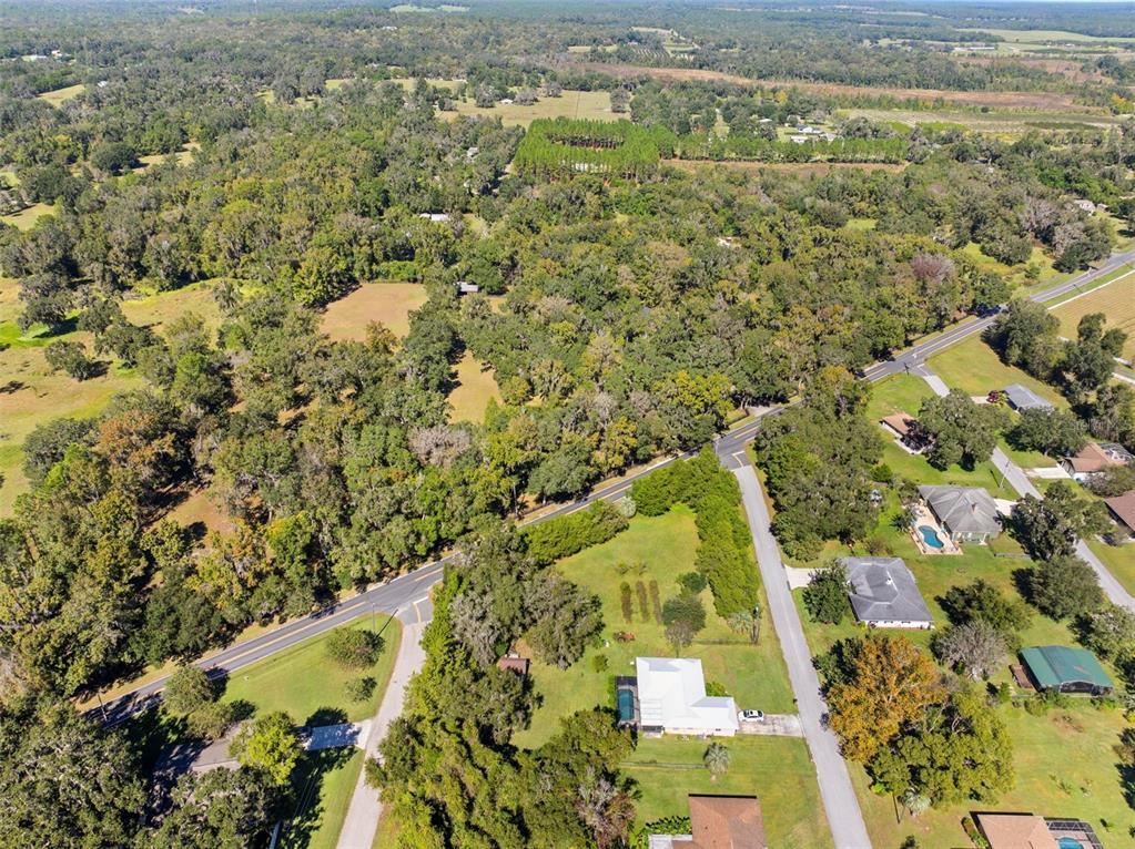 23245 Croom Road Brooksville, FL 34601 - Photo 77 of 79 an aerial view of residential houses with outdoor space