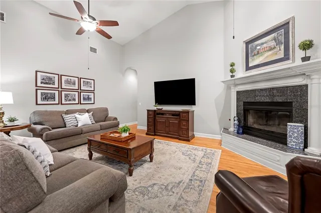 a kitchen with stainless steel appliances granite countertop a sink and wooden cabinets