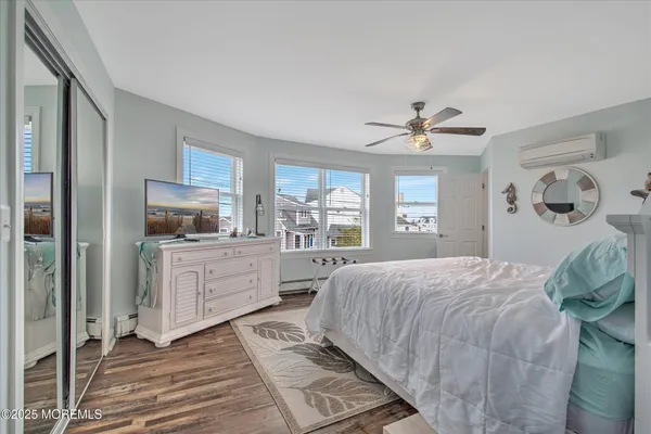 a bed room with a bed and a large window