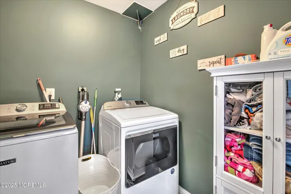 a utility room with dryer and washer