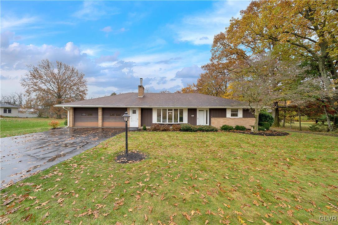 5651 Park Valley Road Schnecksville, PA 18078 - Photo 1 of 32 a front view of a house with a yard