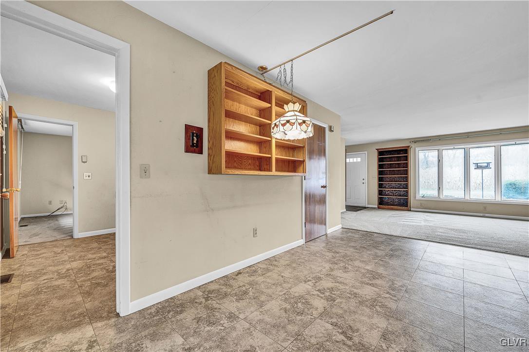 5651 Park Valley Road Schnecksville, PA 18078 - Photo 14 of 32 an empty room with windows and entrance