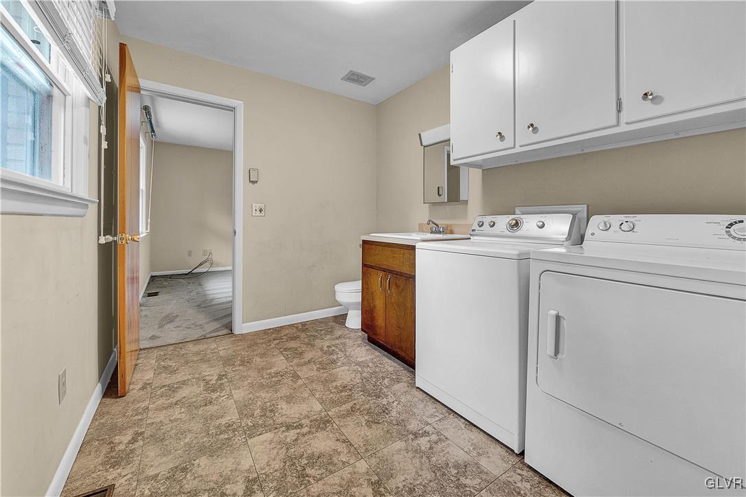 5651 Park Valley Road Schnecksville, PA 18078 - Photo 20 of 32 a view of a storage & utility room with a stove fridge