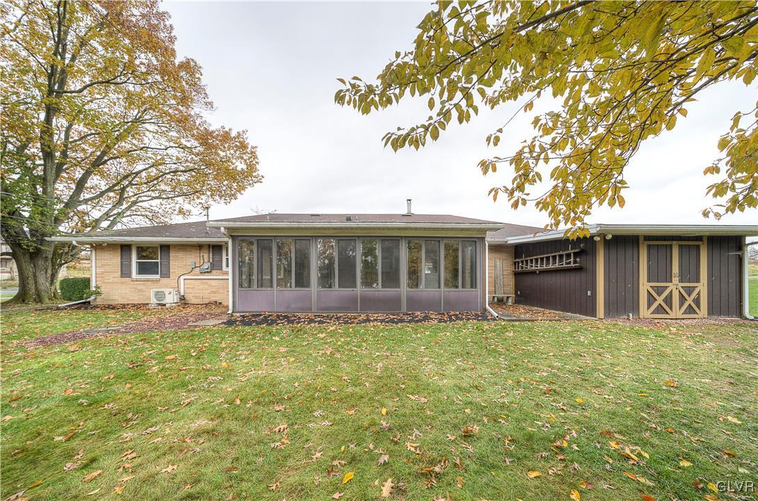 5651 Park Valley Road Schnecksville, PA 18078 - Photo 27 of 32 a front view of house with yard and trees in the background
