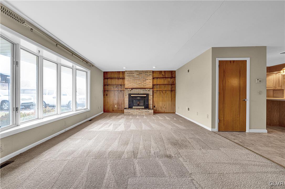 5651 Park Valley Road Schnecksville, PA 18078 - Photo 3 of 32 a view of empty room with a fireplace and windows