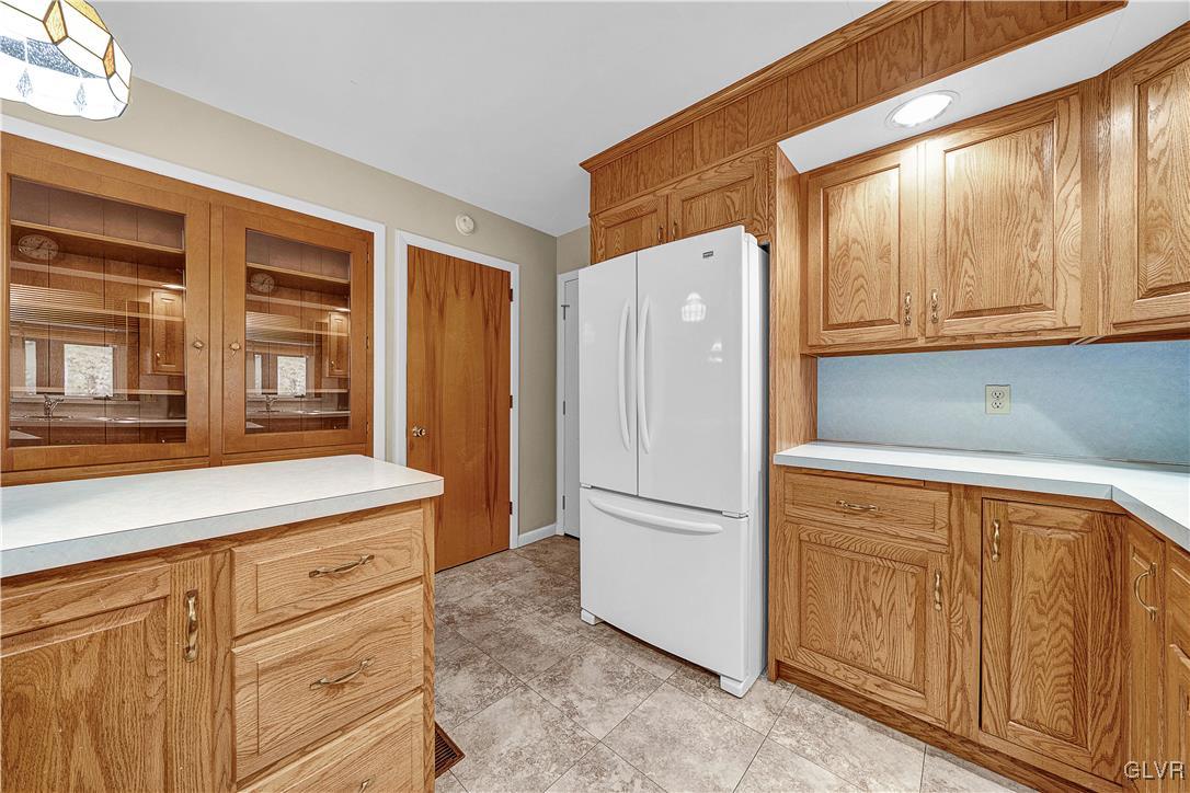 5651 Park Valley Road Schnecksville, PA 18078 - Photo 8 of 32 a kitchen with a refrigerator and a sink