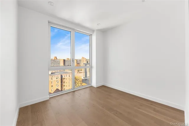 a view of an empty room and a window